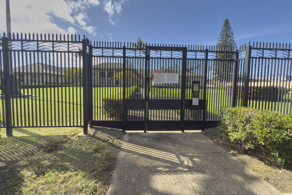 The Dept of Homeland Security Immigration and Customs Enforcement maintains its offices 595 Ala Moana Blvd. It is surrounded by a six foot high wrought iron fence and at least two security gates that remain locked at all times. (David Croxford/Civil Beat/2024)