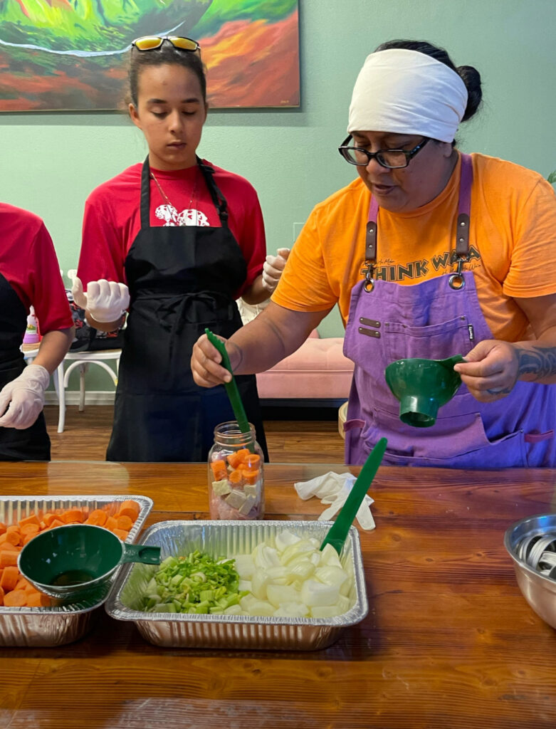 Keala Kahuanui, right, has mastered the art of canning and provisioning long-distance sailing canoes.